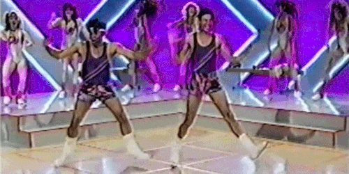 Women Doing Aerobics While Military Coup Is Happening Behind Her