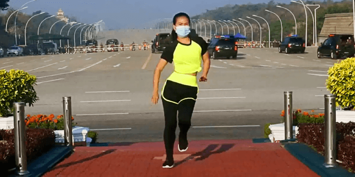Women Doing Aerobics While Military Coup Is Happening Behind Her